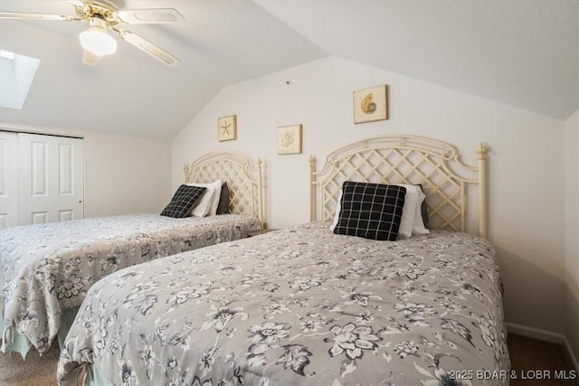 bedroom with carpet, a closet, vaulted ceiling, and ceiling fan