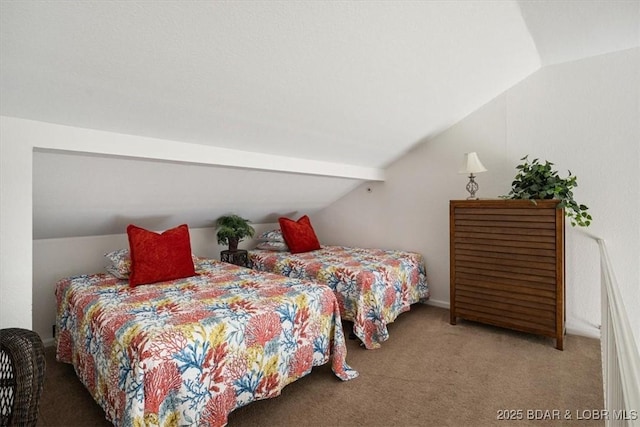 carpeted bedroom with lofted ceiling