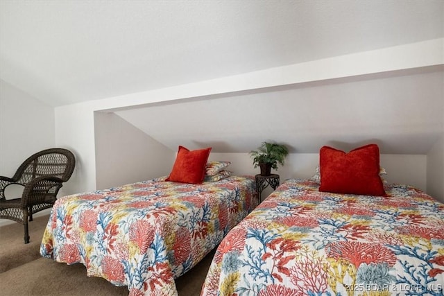 carpeted bedroom with vaulted ceiling