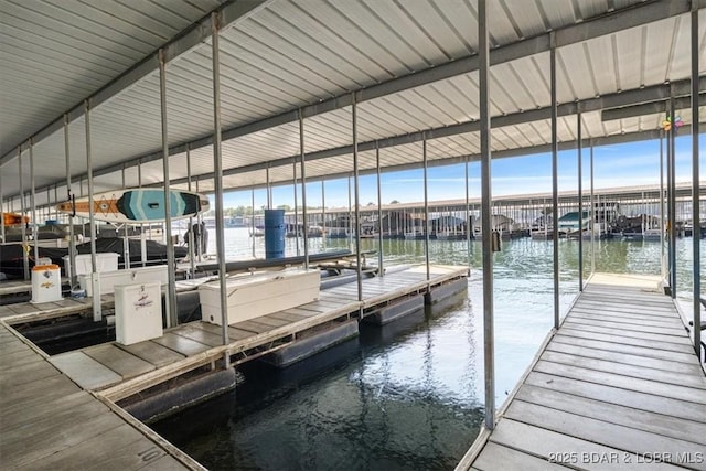 view of dock featuring a water view and boat lift