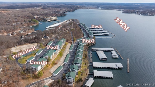 birds eye view of property with a water view