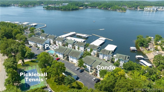 bird's eye view featuring a water view and a residential view