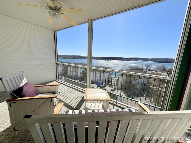 exterior space featuring a water view and ceiling fan