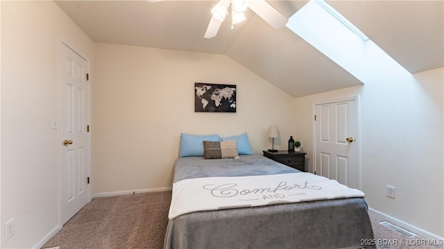 bedroom with visible vents, baseboards, lofted ceiling, ceiling fan, and carpet