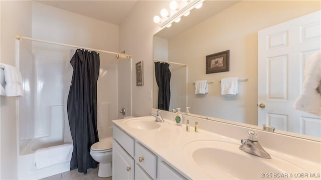 bathroom featuring shower / bath combo, a sink, toilet, and double vanity