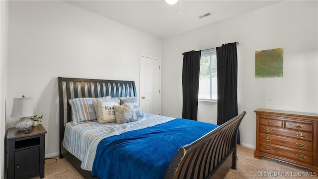 bedroom featuring carpet floors, baseboards, and visible vents