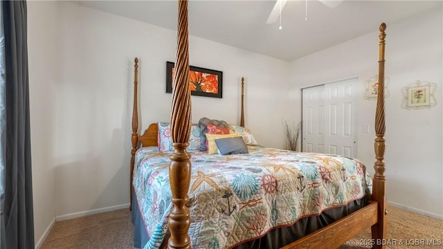 carpeted bedroom featuring a closet, ceiling fan, and baseboards