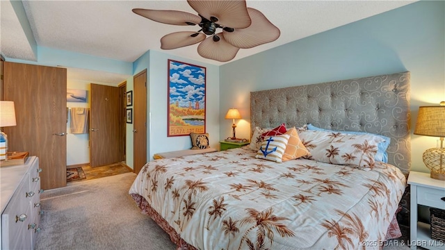 carpeted bedroom with a ceiling fan