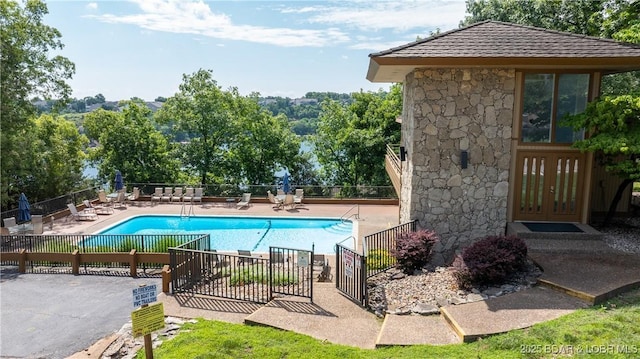 pool featuring a patio area and fence