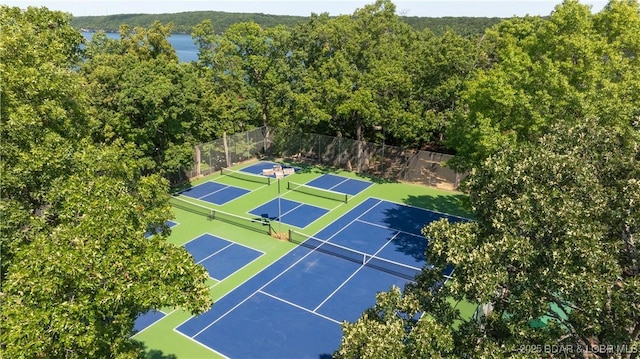 view of tennis court with fence