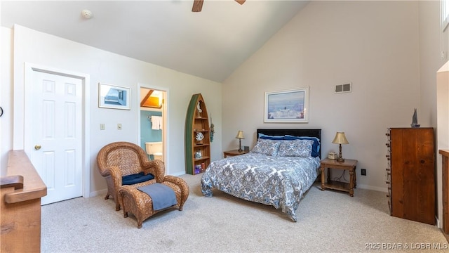 bedroom featuring high vaulted ceiling, connected bathroom, visible vents, a ceiling fan, and carpet