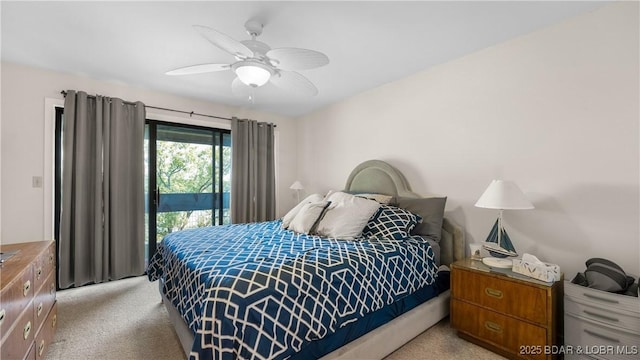 bedroom featuring a ceiling fan and light colored carpet