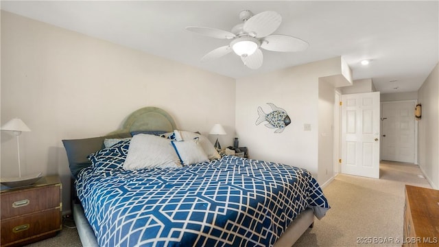 carpeted bedroom featuring ceiling fan and baseboards