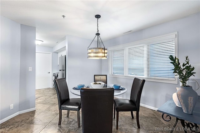 dining area featuring visible vents and baseboards