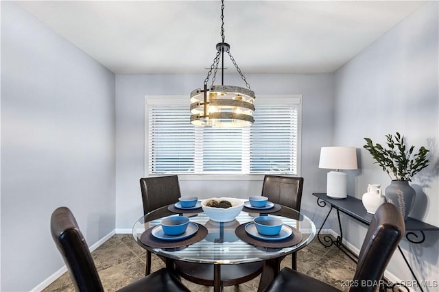 dining area featuring baseboards