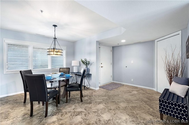 dining room featuring baseboards