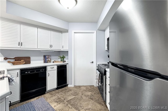 kitchen with black dishwasher, light countertops, freestanding refrigerator, white cabinetry, and range with electric cooktop