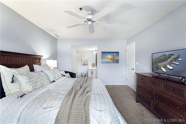 bedroom featuring baseboards, visible vents, a ceiling fan, ensuite bathroom, and carpet