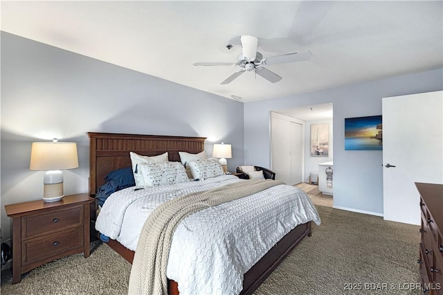 carpeted bedroom with baseboards, a ceiling fan, and ensuite bathroom