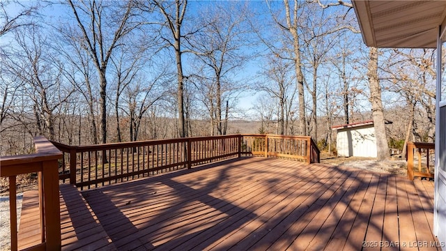 deck with an outdoor structure and a shed