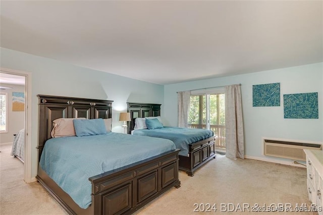 bedroom featuring access to exterior, baseboards, and light colored carpet