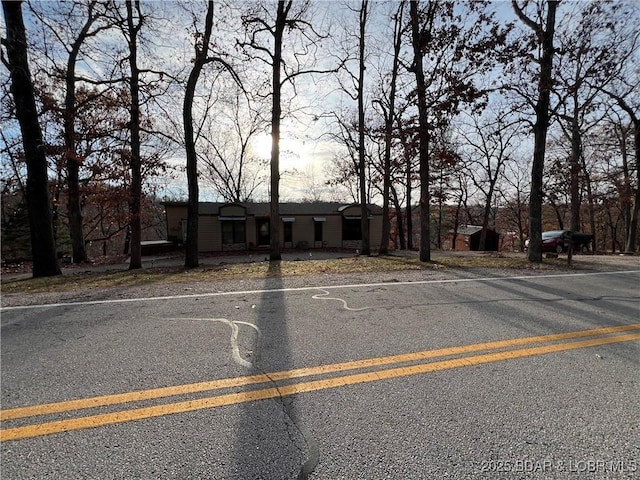 view of front facade with uncovered parking