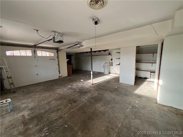 garage featuring visible vents and a garage door opener