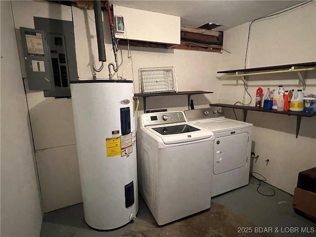 washroom featuring laundry area, electric panel, washer and clothes dryer, and electric water heater