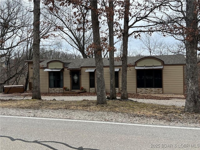 view of front of house with stone siding