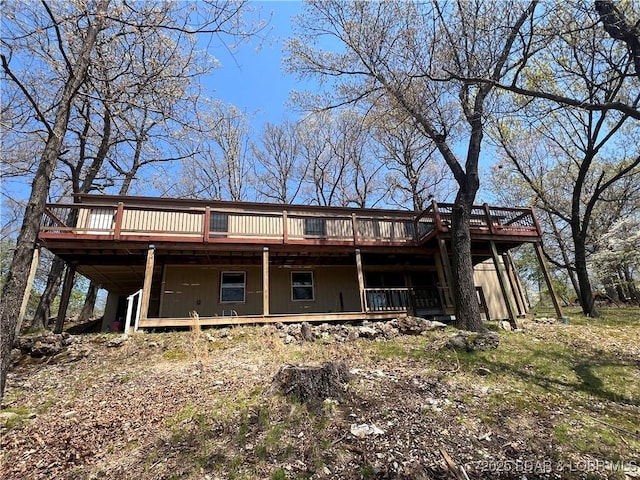 back of property featuring a deck