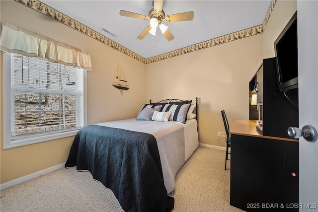 bedroom with ceiling fan, carpet, visible vents, and baseboards