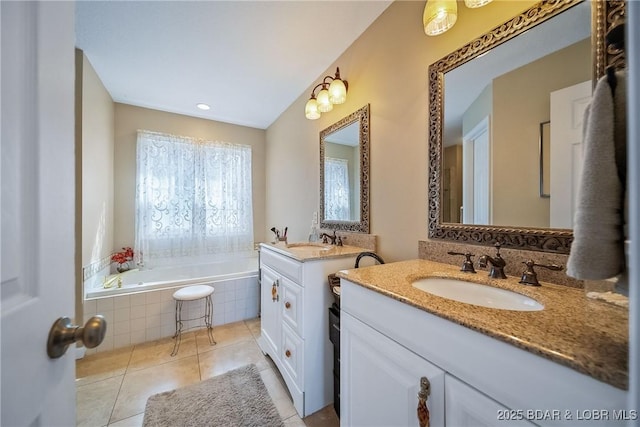 full bathroom featuring tile patterned flooring, two vanities, a sink, and a bath