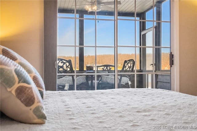 bedroom with expansive windows and multiple windows