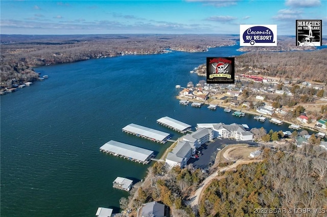 birds eye view of property with a water view