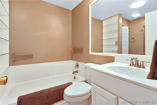 bathroom with vanity, toilet, and a bath