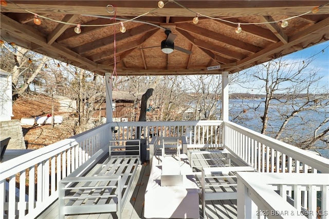 wooden deck with a gazebo and a water view