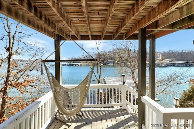 wooden deck featuring a water view