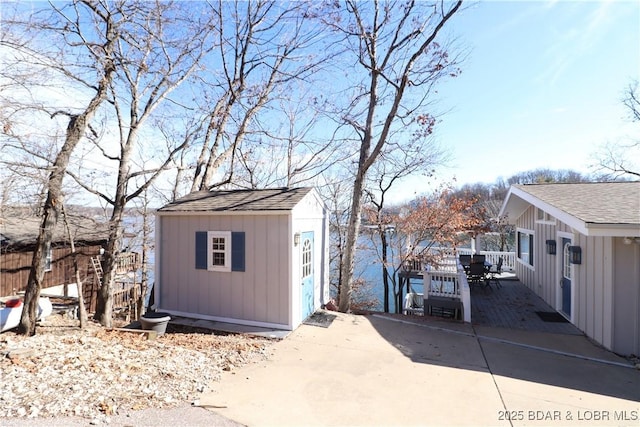 view of shed featuring fence