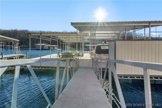 view of dock featuring a water view and boat lift