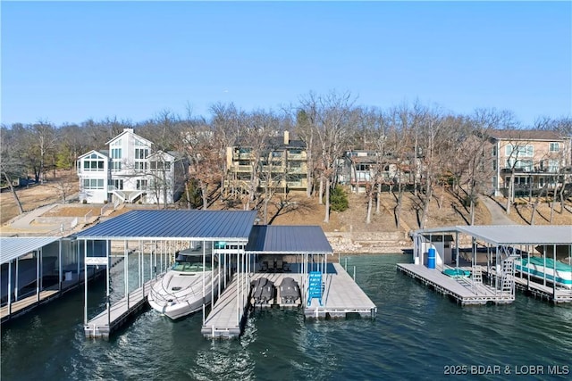 view of dock featuring a water view and boat lift