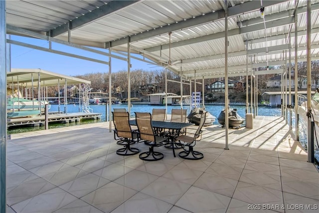 view of patio / terrace featuring a dock and a water view