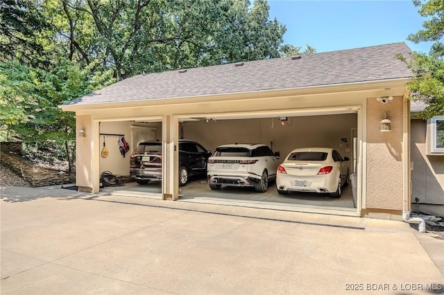 view of vehicle parking featuring a garage and concrete driveway