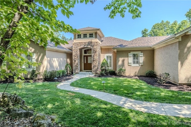 view of front facade featuring stone siding, a front lawn, and stucco siding