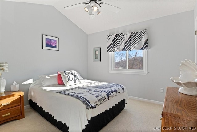 bedroom featuring a ceiling fan, vaulted ceiling, light colored carpet, and baseboards