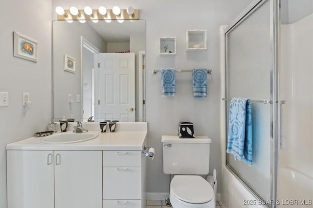 bathroom featuring toilet, an enclosed shower, tile patterned flooring, and vanity