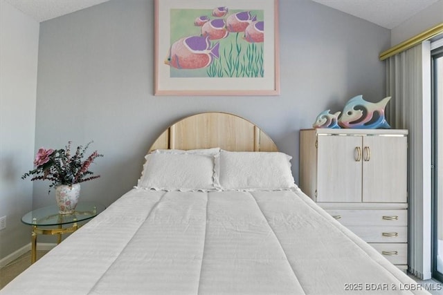 bedroom featuring vaulted ceiling