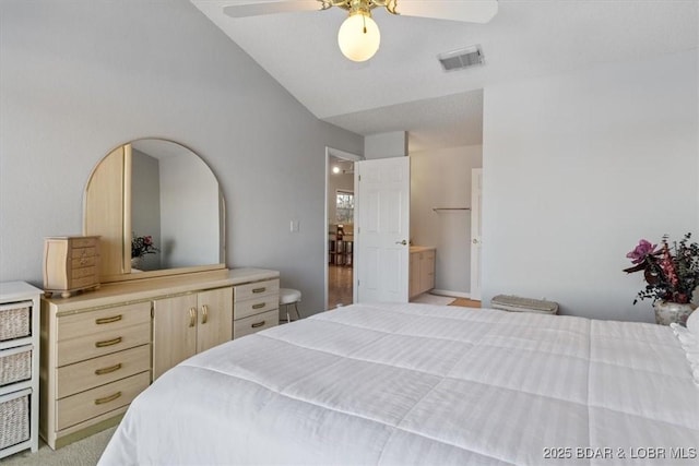 bedroom featuring light carpet, visible vents, ceiling fan, and lofted ceiling