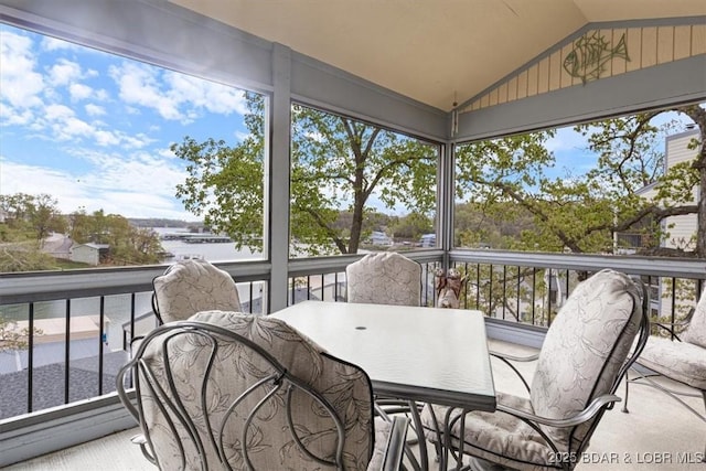 sunroom featuring plenty of natural light and outdoor dining space