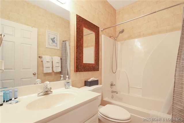 full bathroom featuring toilet, shower / bathtub combination with curtain, tile walls, and vanity