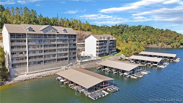 birds eye view of property featuring a water view